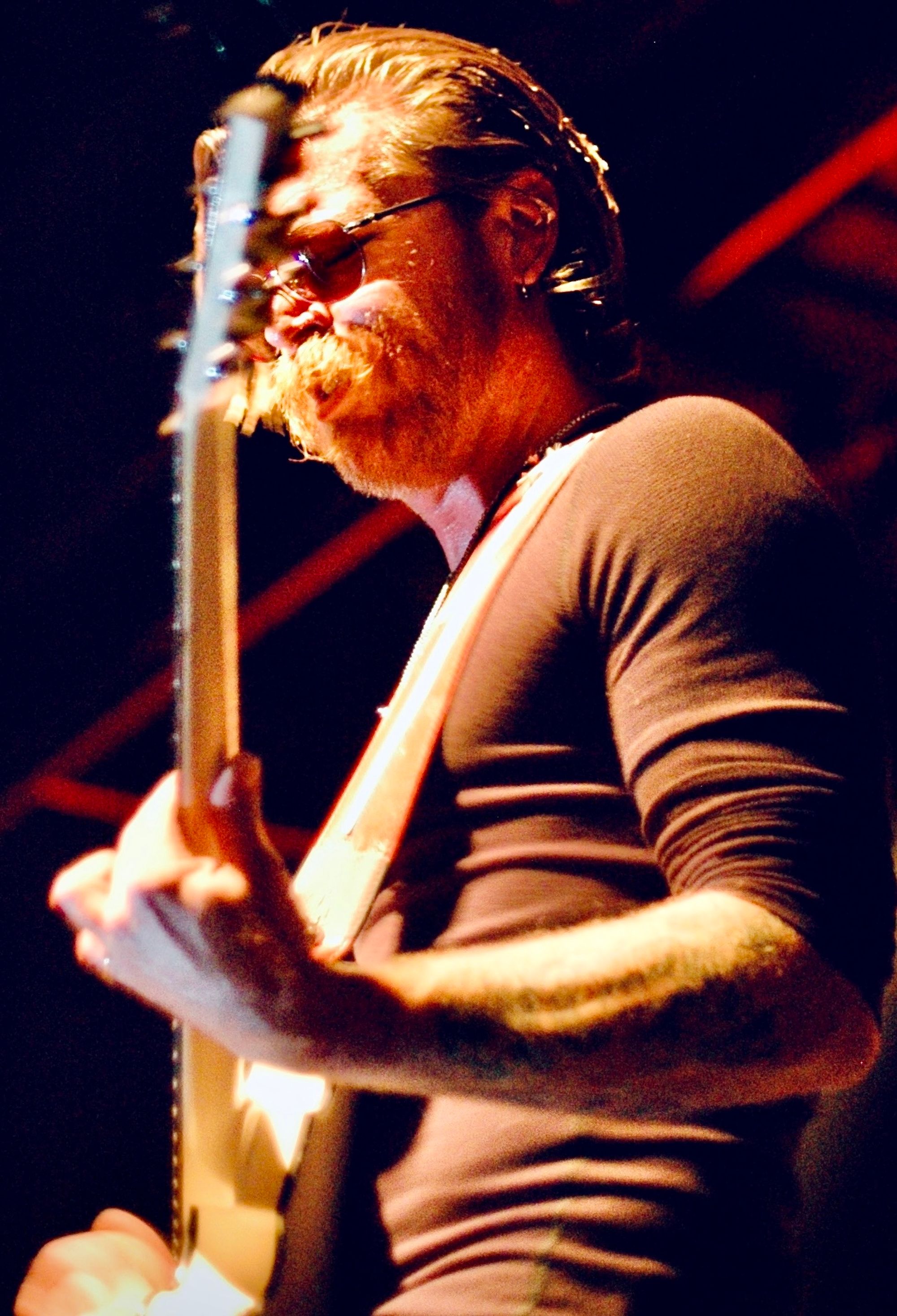 Close-up of musician performing with dramatic concert photography lighting